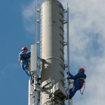 Telecom technicians at work on an LTE base station